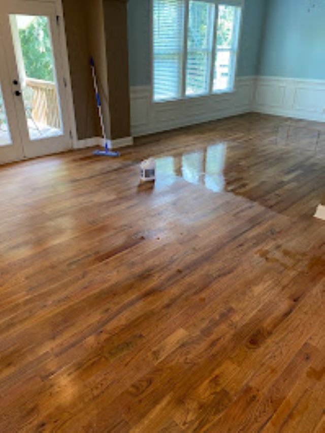 Imbue cleaning solutions worker applying polyurethane on wood floor after lightly sanding wood floors this is apart of our wood floor cleaning program