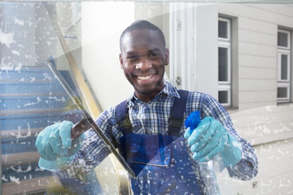 Imbue Cleaning Solutions worker performing window and gutter cleaning services